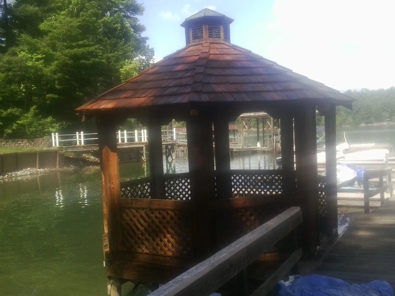 Cedar shake gazebo roof rebuilt on a lake dock in Albemarle